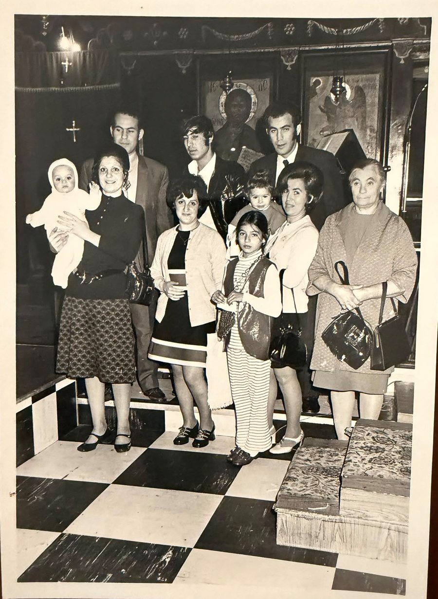 Three generations of the family photographed together at a christening in the village church. Family archive photograph.